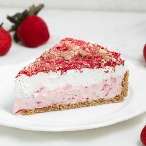 Easy strawberry shortcake cheesecake is a creamy baked cheesecake with strawberry flavor, a vanilla wafer crust, and a sweet strawberry crunch topping.