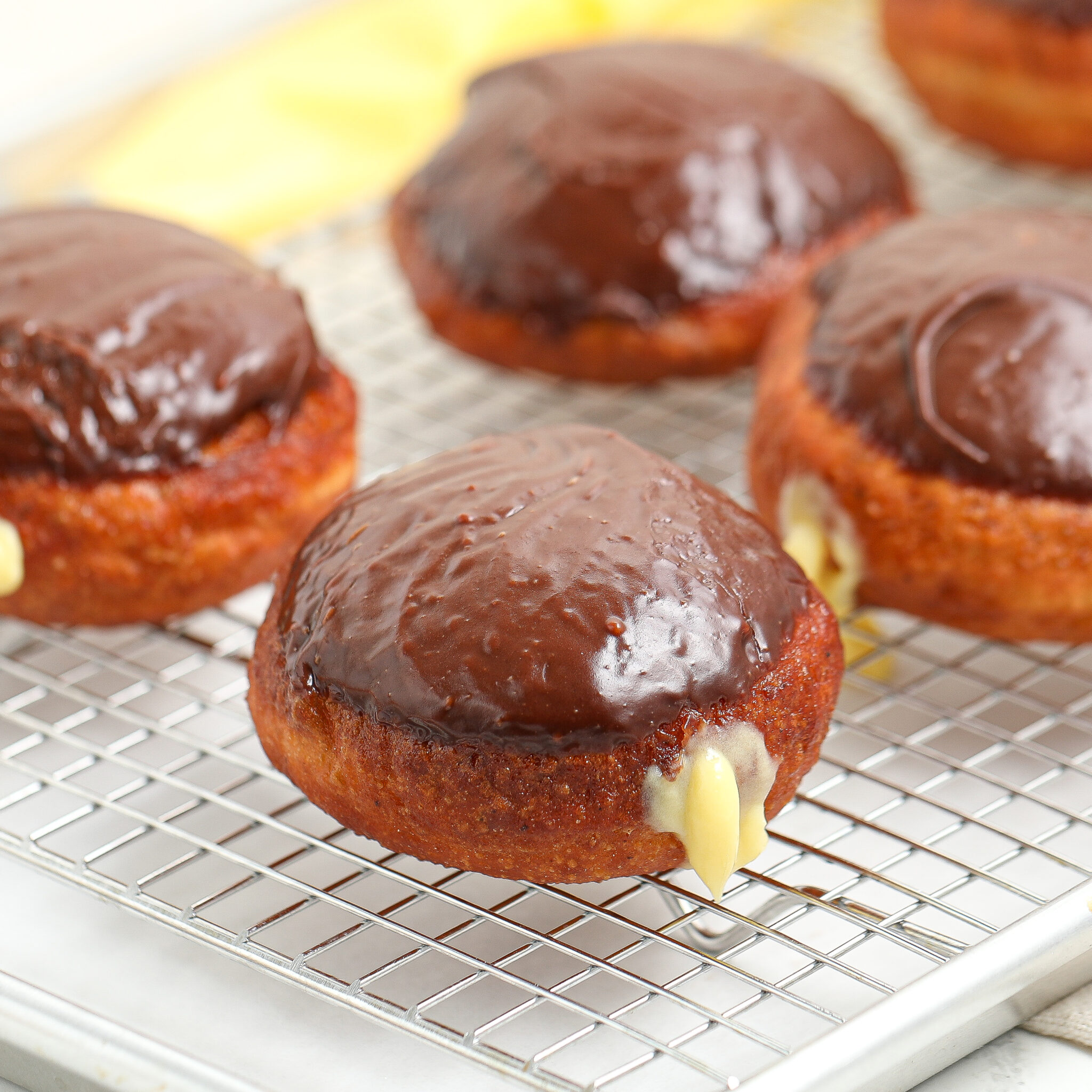 Homemade Boston Cream Doughnuts with Pastry Cream and Chocolate Glaze