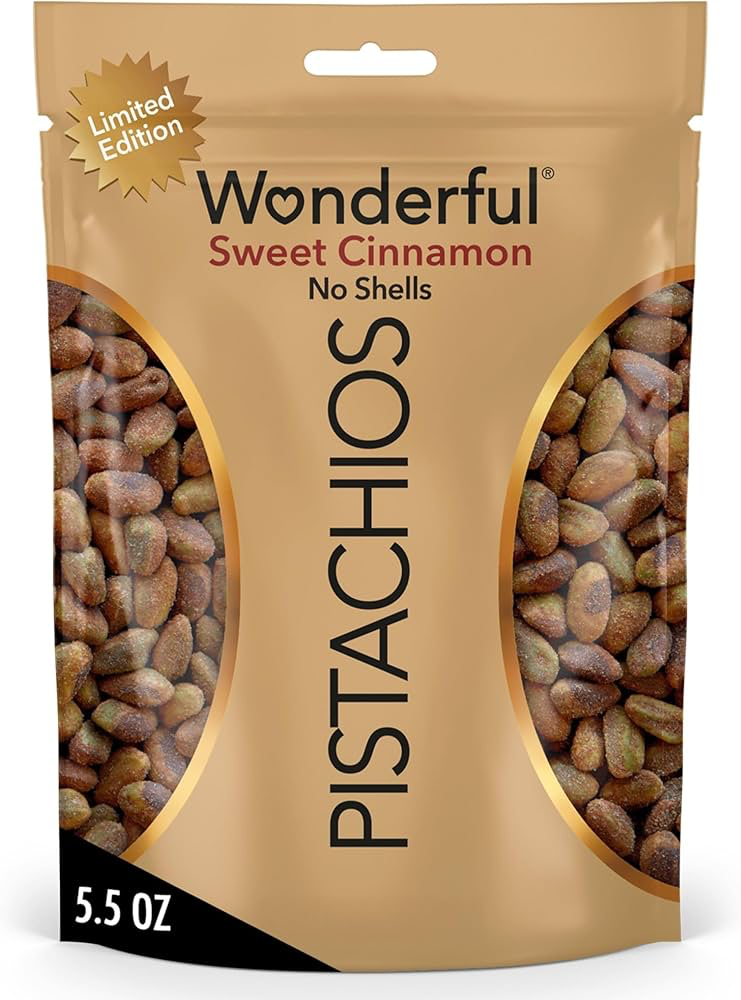 Gold resealable bag of Wonderful Pistachios No Shells in sweet cinnamon flavor, limited edition, with visible seasoned pistachios inside.