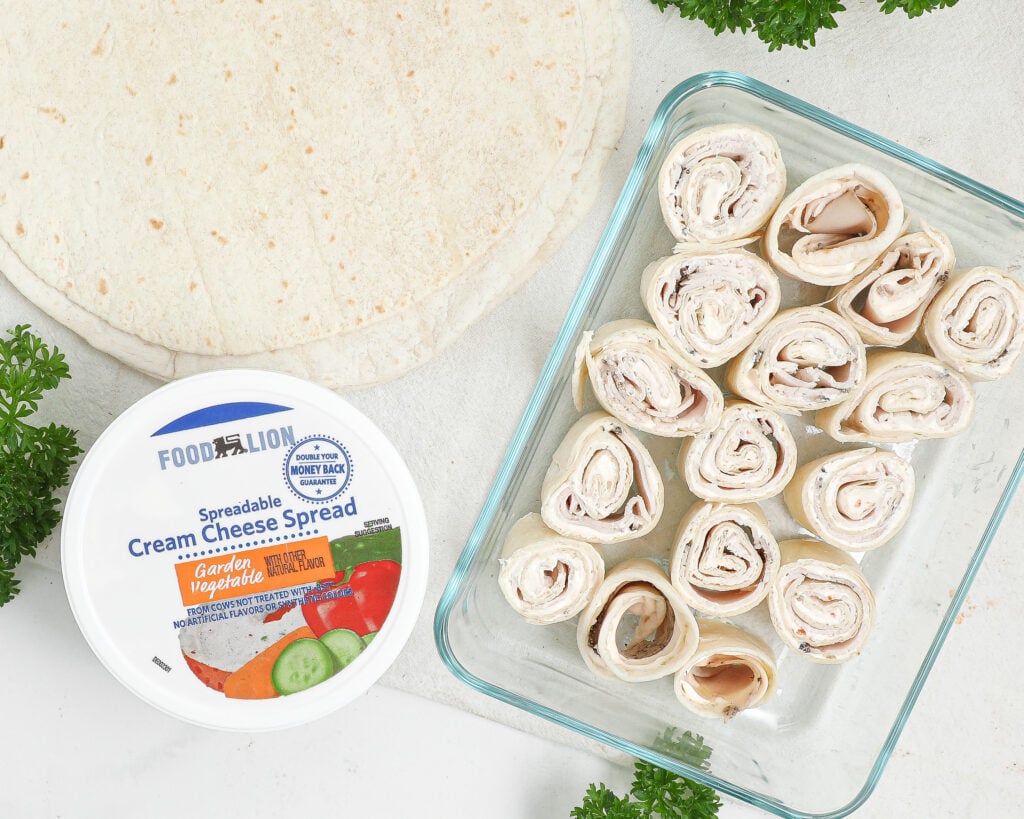 Turkey pinwheels made with Food Lion garden vegetable cream cheese spread, tortillas, and deli turkey for easy beach snacks