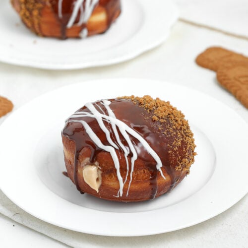 Biscoff cream filled doughnut topped with cookie butter, white chocolate, and crushed Lotus Biscoff cookies.