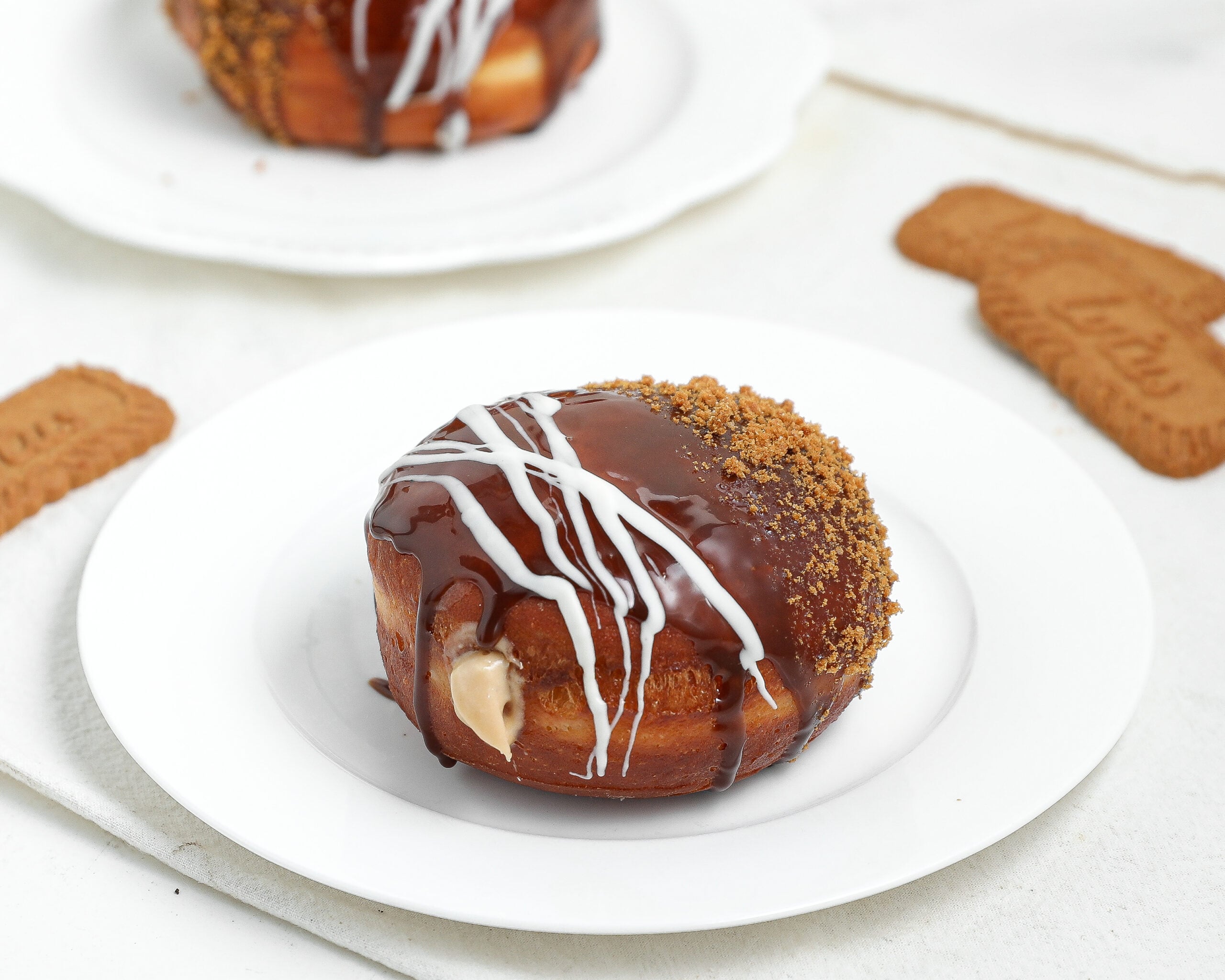 Biscoff cream filled doughnut topped with cookie butter, white chocolate, and crushed Lotus Biscoff cookies.