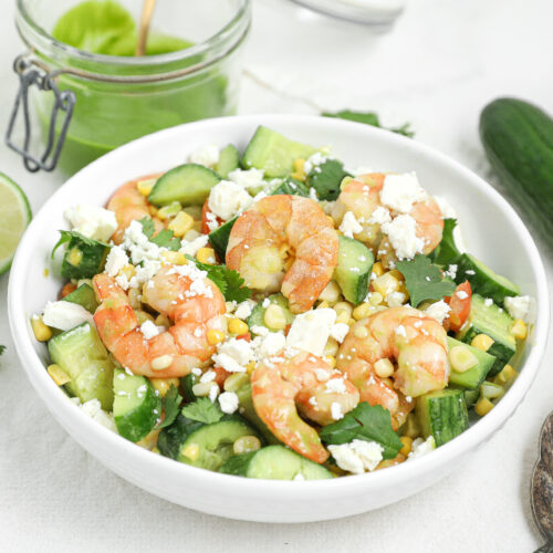 Shrimp cucumber corn salad with roasted shrimp, corn, cucumber, feta, and cilantro vinaigrette.