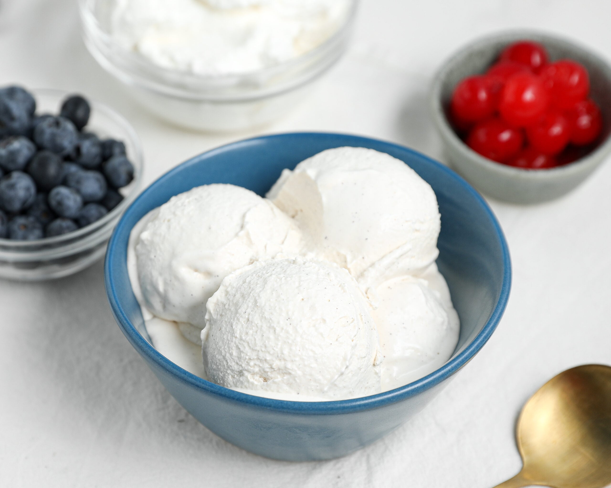 Homemade Vanilla Ice Cream is rich, creamy, and made with simple ingredients including cream, milk, egg yolks, sugar, and vanilla.