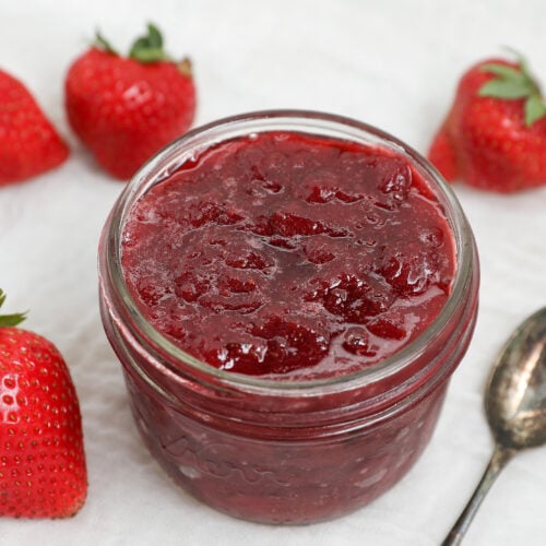 Homemade 3 ingredient strawberry jam made with fresh strawberries in a glass mason jar.