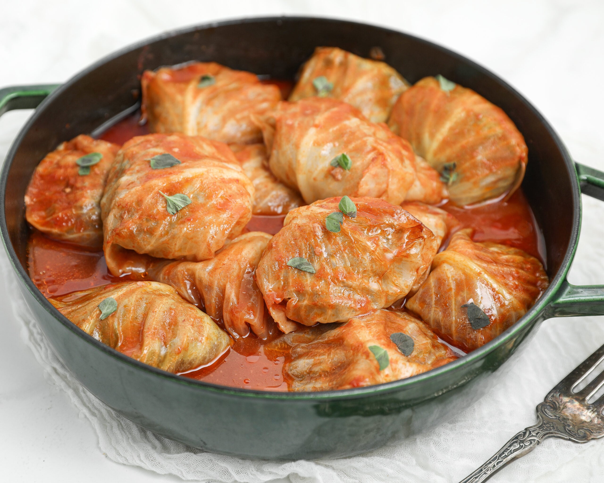 Bloody Mary cabbage rolls stuffed with beef, pork and rice baked in a savory tomato sauce.