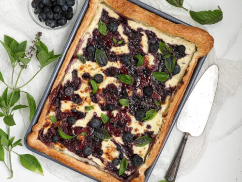 Blueberry Blue Cheese Tart with puff pastry, blueberry jam, fresh blueberries, and basil.