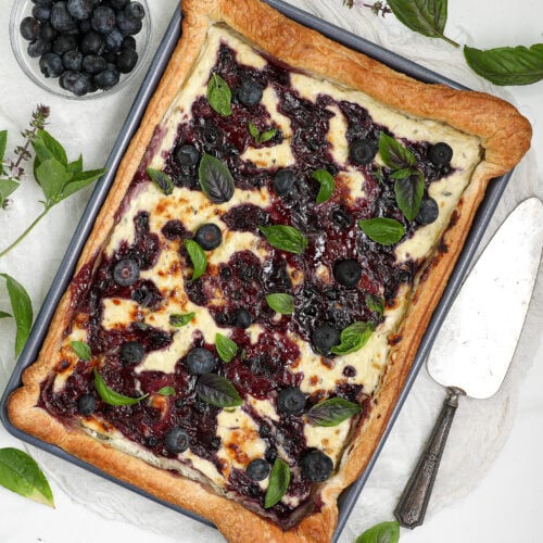 Blueberry Blue Cheese Tart with puff pastry, blueberry jam, fresh blueberries, and basil.