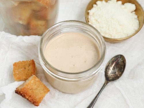Creamy eggless Caesar dressing made without raw eggs or anchovies served with Parmesan and croutons.