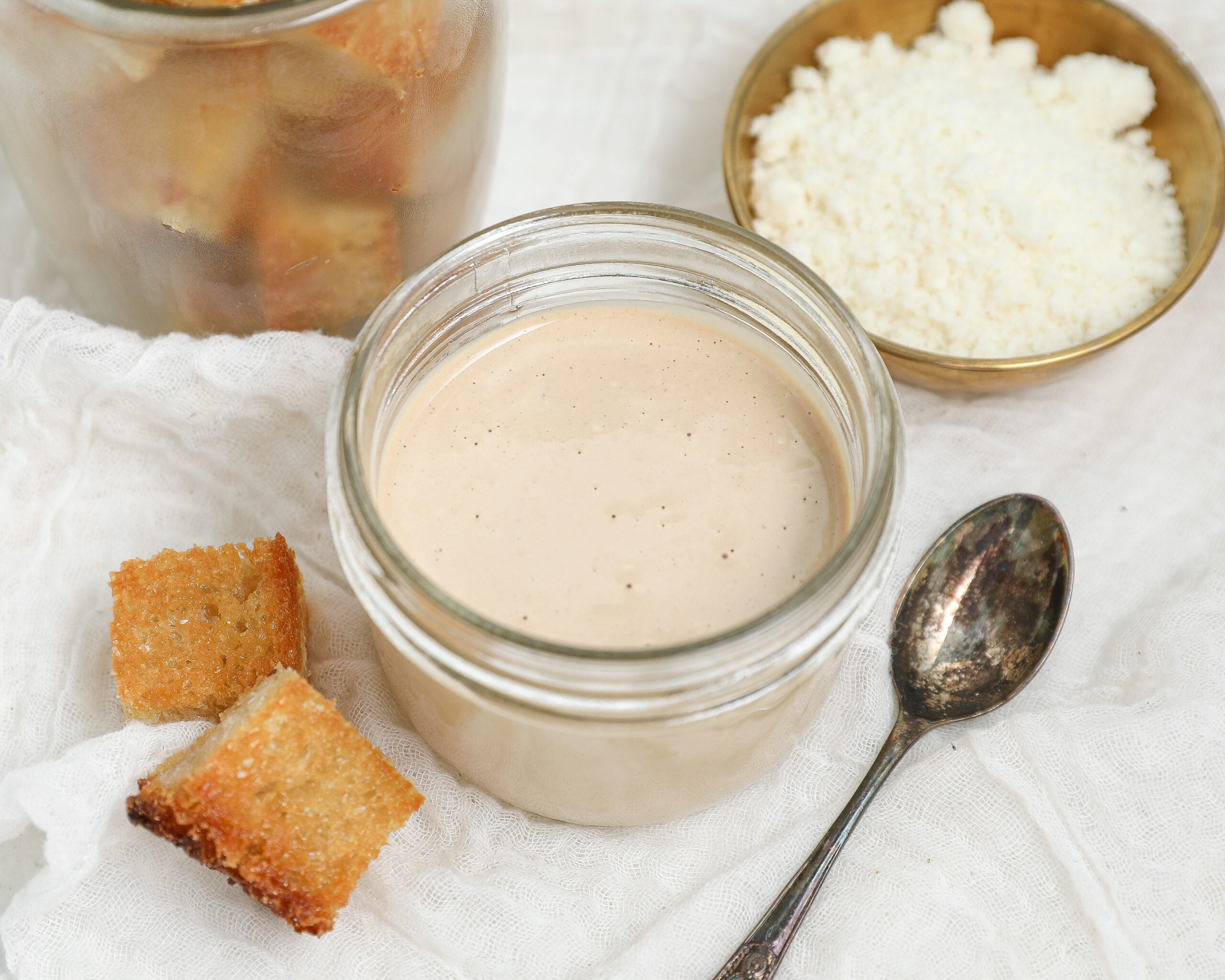 Creamy eggless Caesar dressing made without raw eggs or anchovies served with Parmesan and croutons.