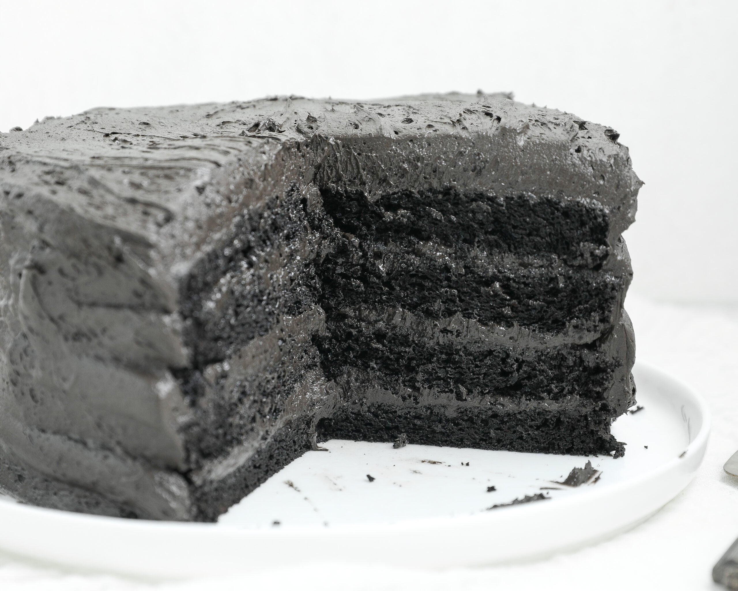 Black Cocoa Cake with dark chocolate frosting and three moist chocolate cake layers.