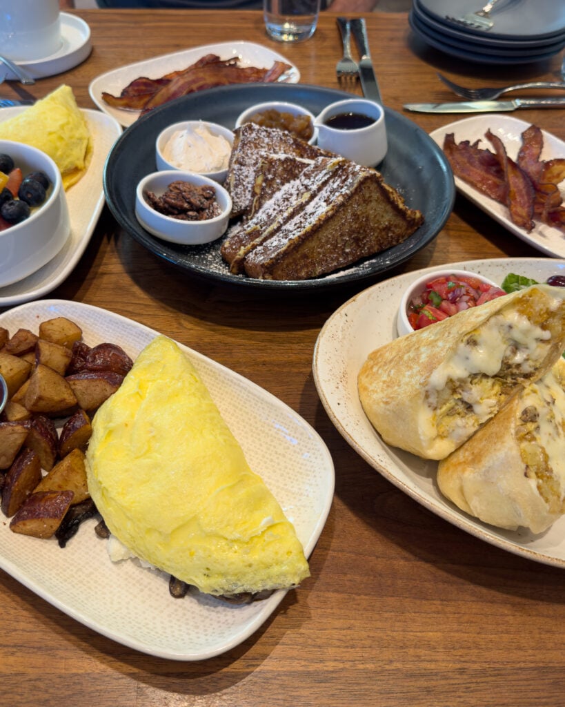 Breakfast spread at Bargello with French toast, an omelet, potatoes, and other dishes.